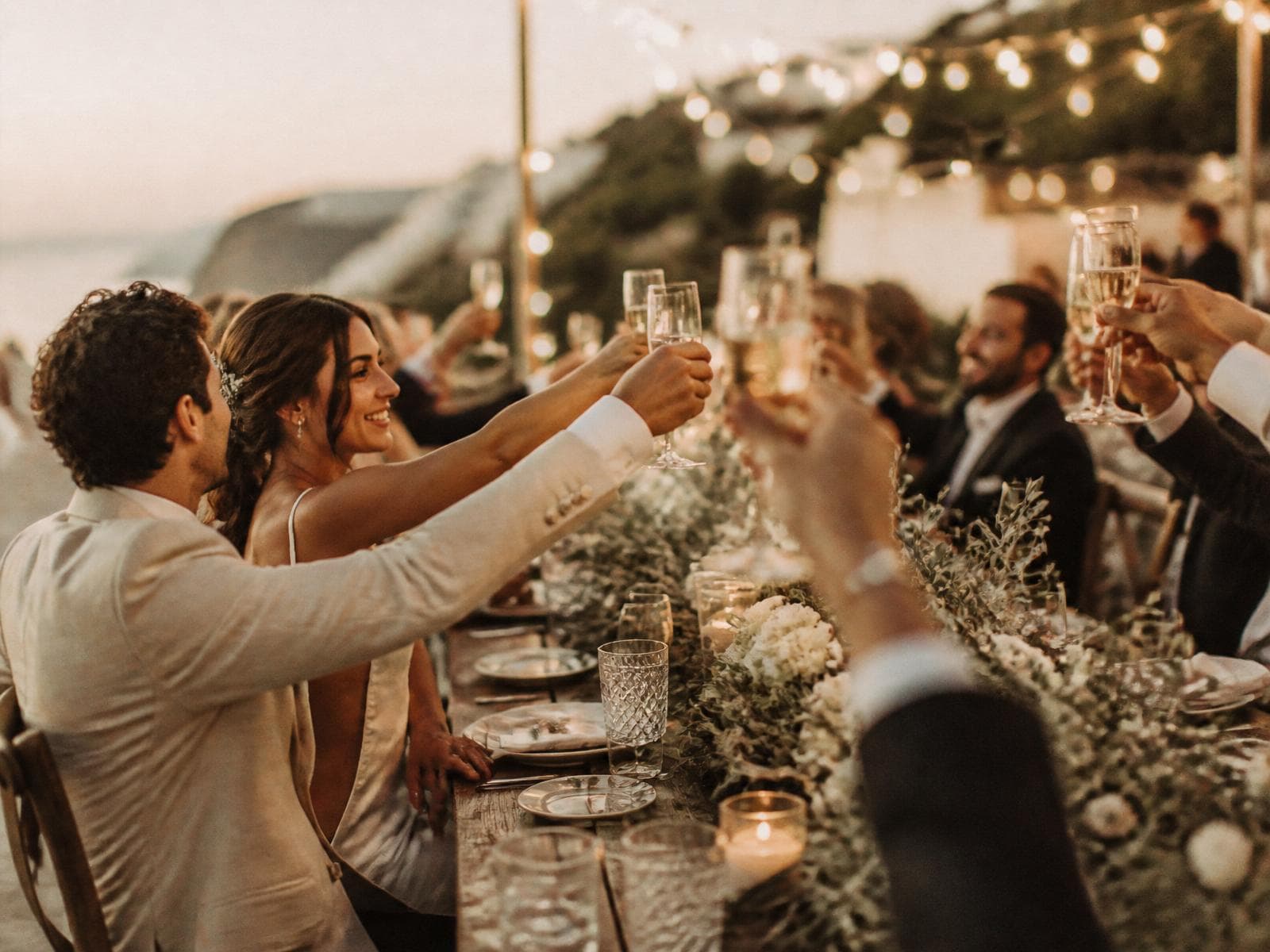 Wedding reception guests celebrating — moments guests often capture on their phones